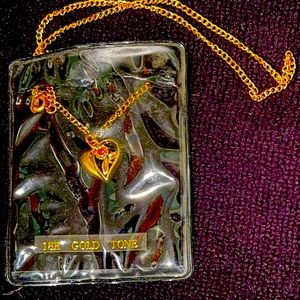 18k gold tone necklace with heart and leaves pendant with ruby gem